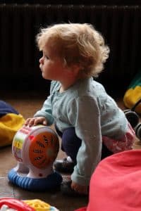 a young child playing with a toy