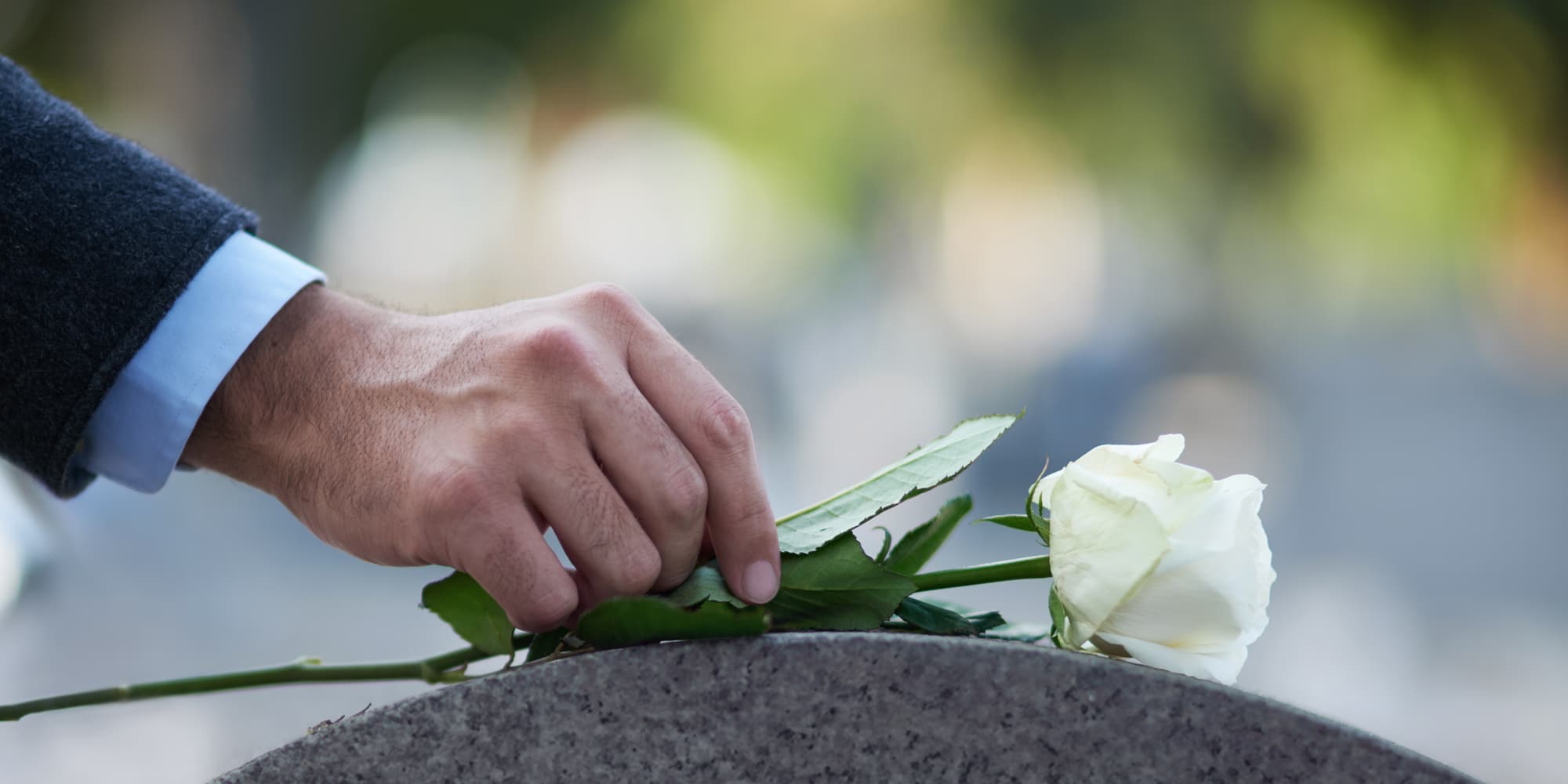 a man holding a flower