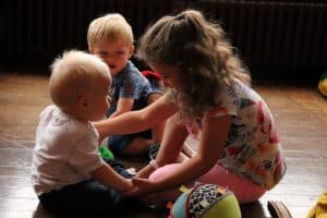 three young children playing